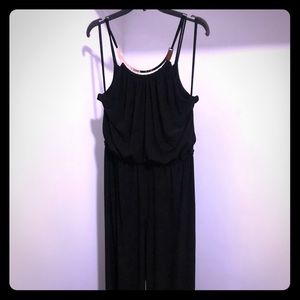 Black full length romper. Gold neck feature.